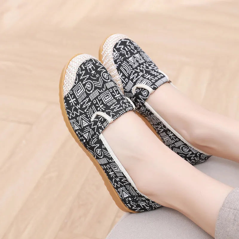 Women's ethnic style cloth shoes with shallow mouth design, colour stitching, and flat heel
