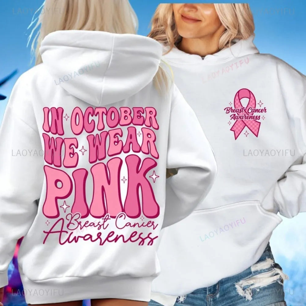 Women's pink pullover hoodie with a retro-style graphic print for breast cancer awareness and a side seam pocket.