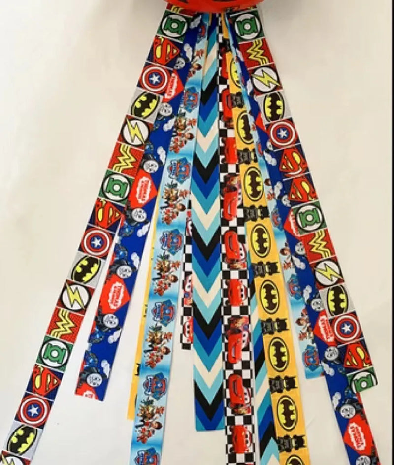 Helmet streamer for children's roller skating and skiing, available in 12 solid colours and 23 colour sets, made from durable polyester ribbon with a length of 60 cm for secure attachment.