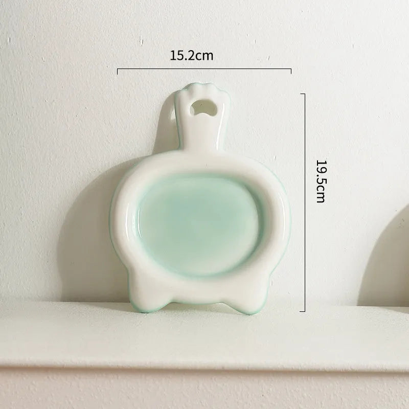 Ceramic cat bowl in blue colour with shallow mouth design for pet food and water.