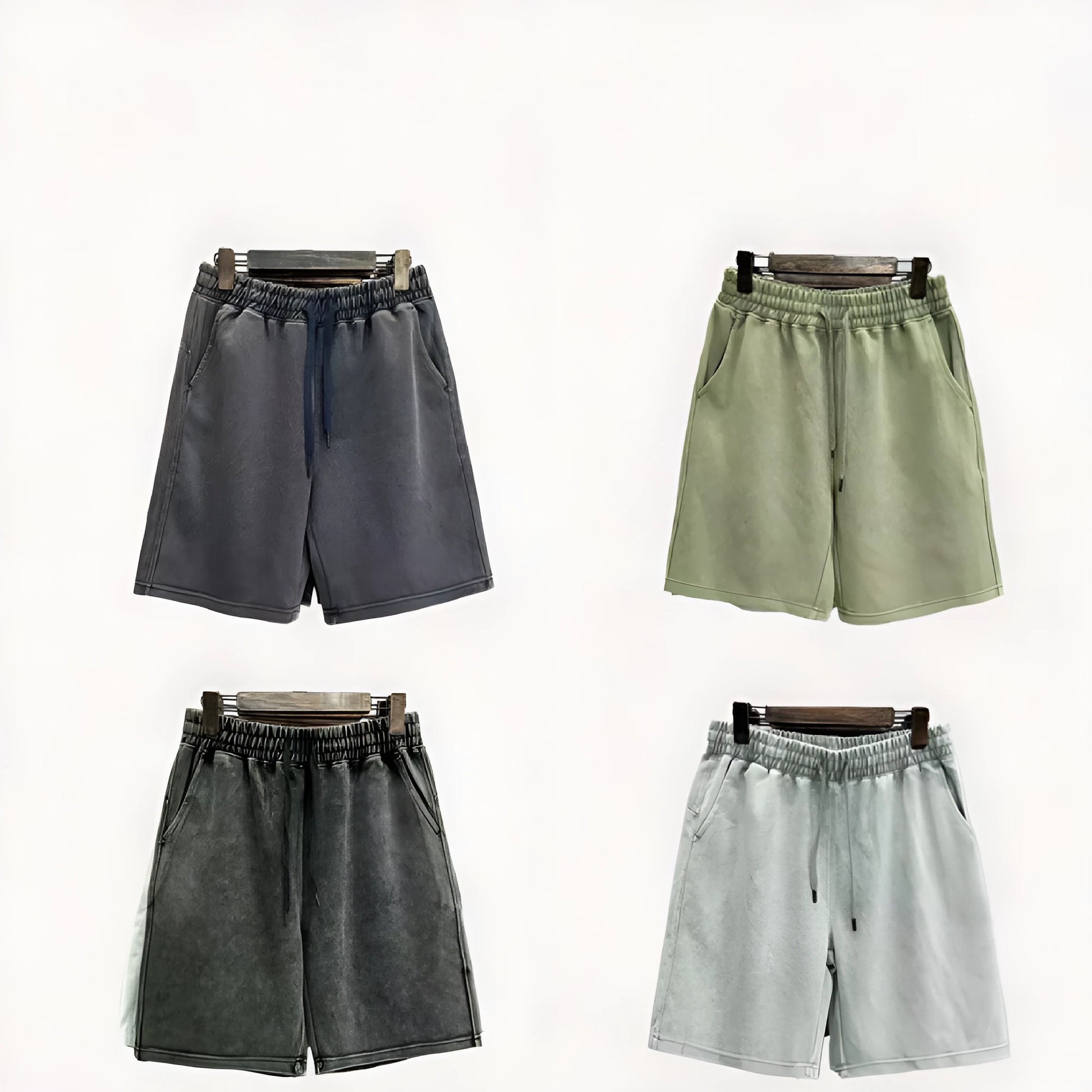 Men's distressed light blue cotton shorts with a loose straight-leg casual fit on a neutral background