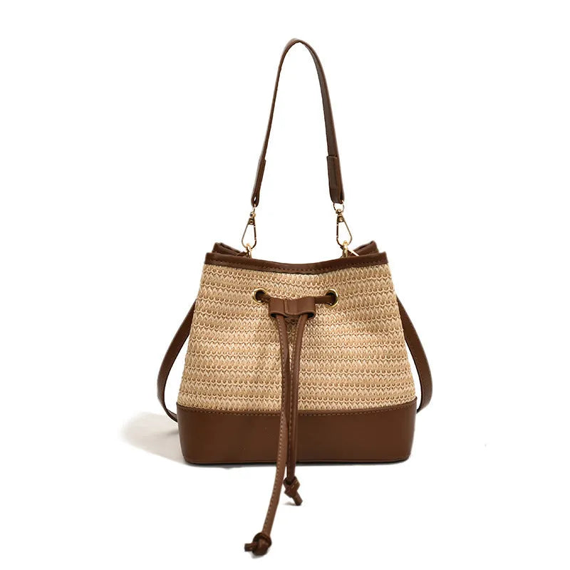 Woven straw women's crossbody bucket bag in brown colour with adjustable strap