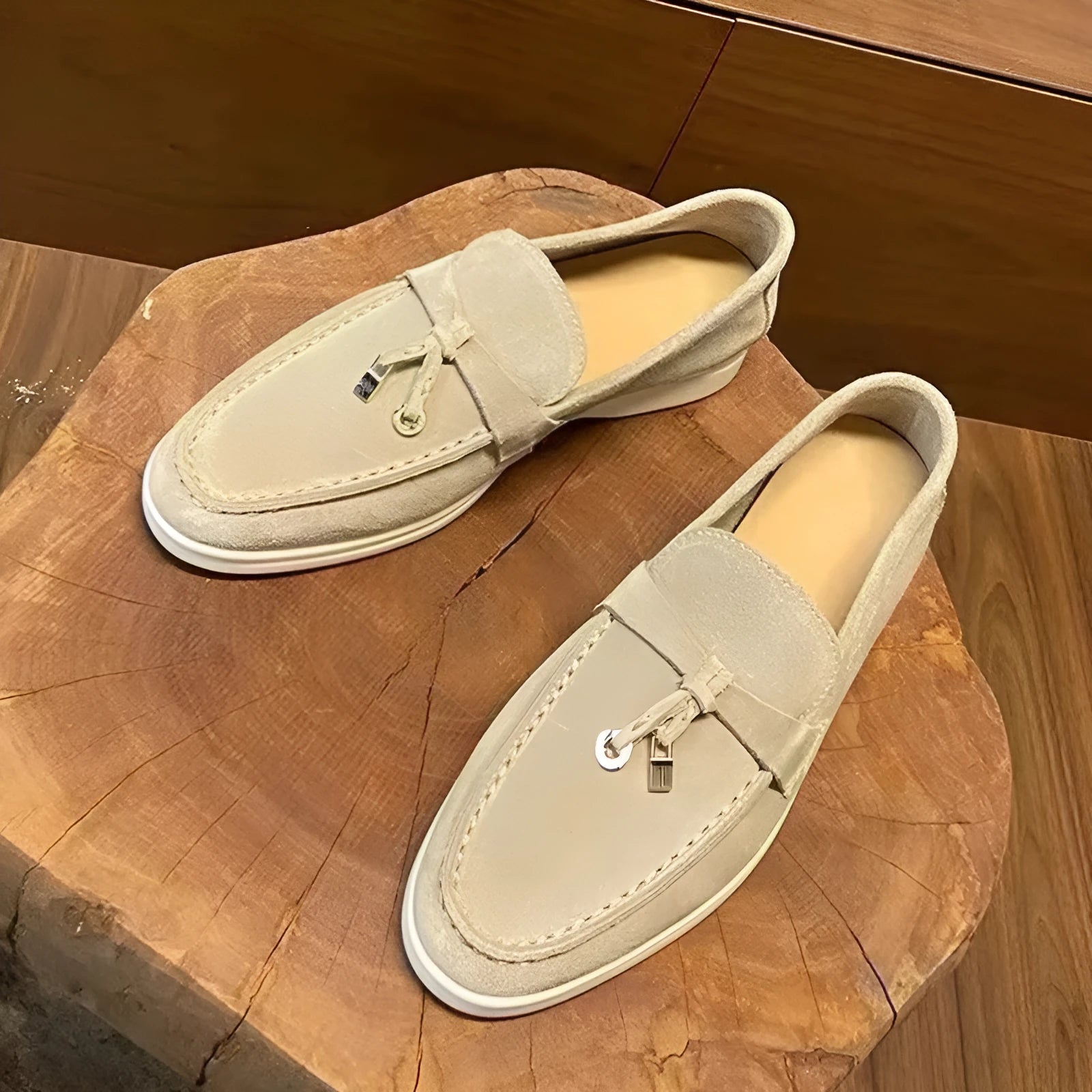 High top slip-on loafers in black with round toe and sewing line detail on a rubber sole.