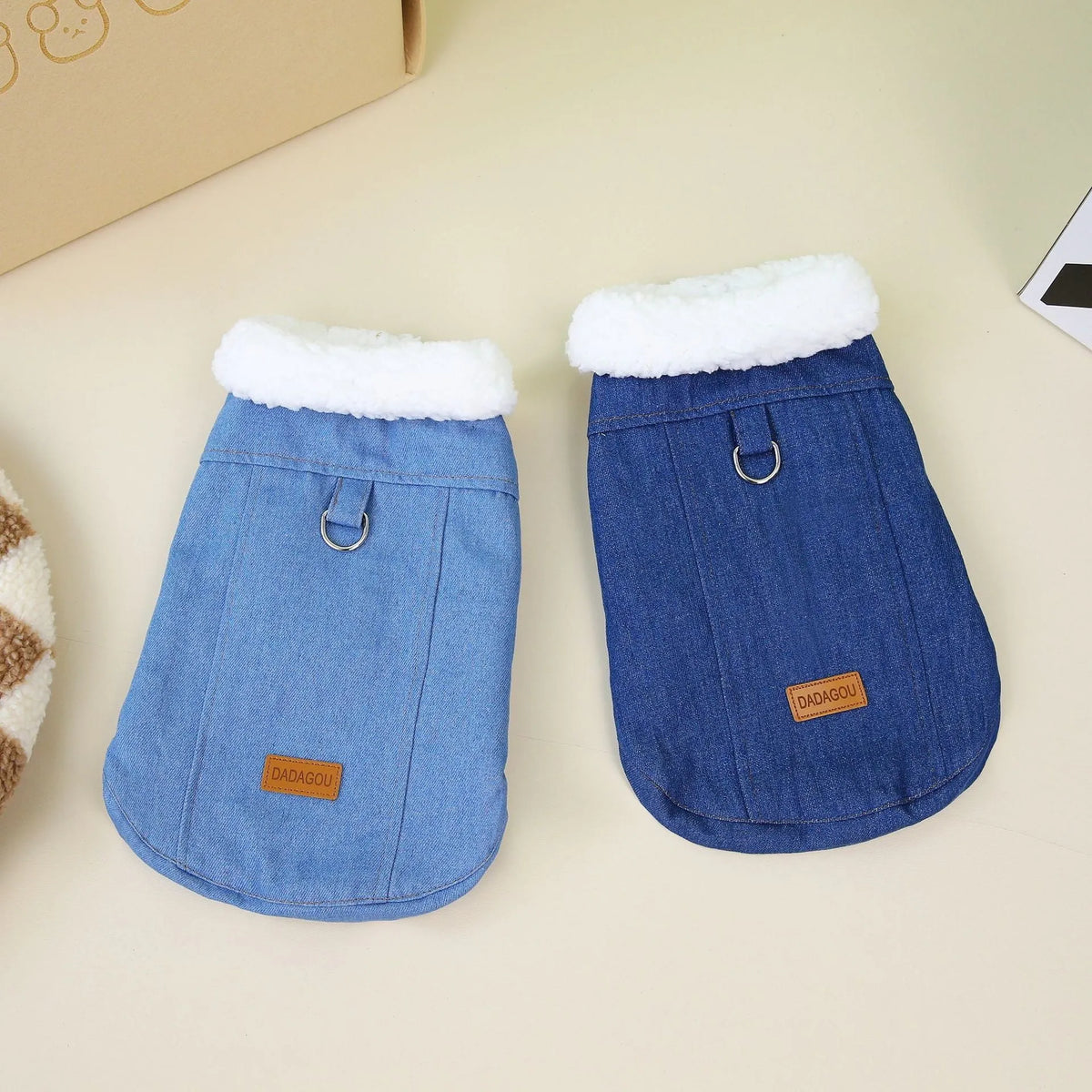 Dark blue denim cotton coat for corgi dog on mannequin, showing button front and full coverage design