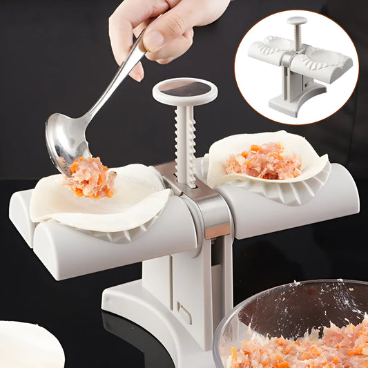 White double-head manual dumpling maker press on a kitchen counter