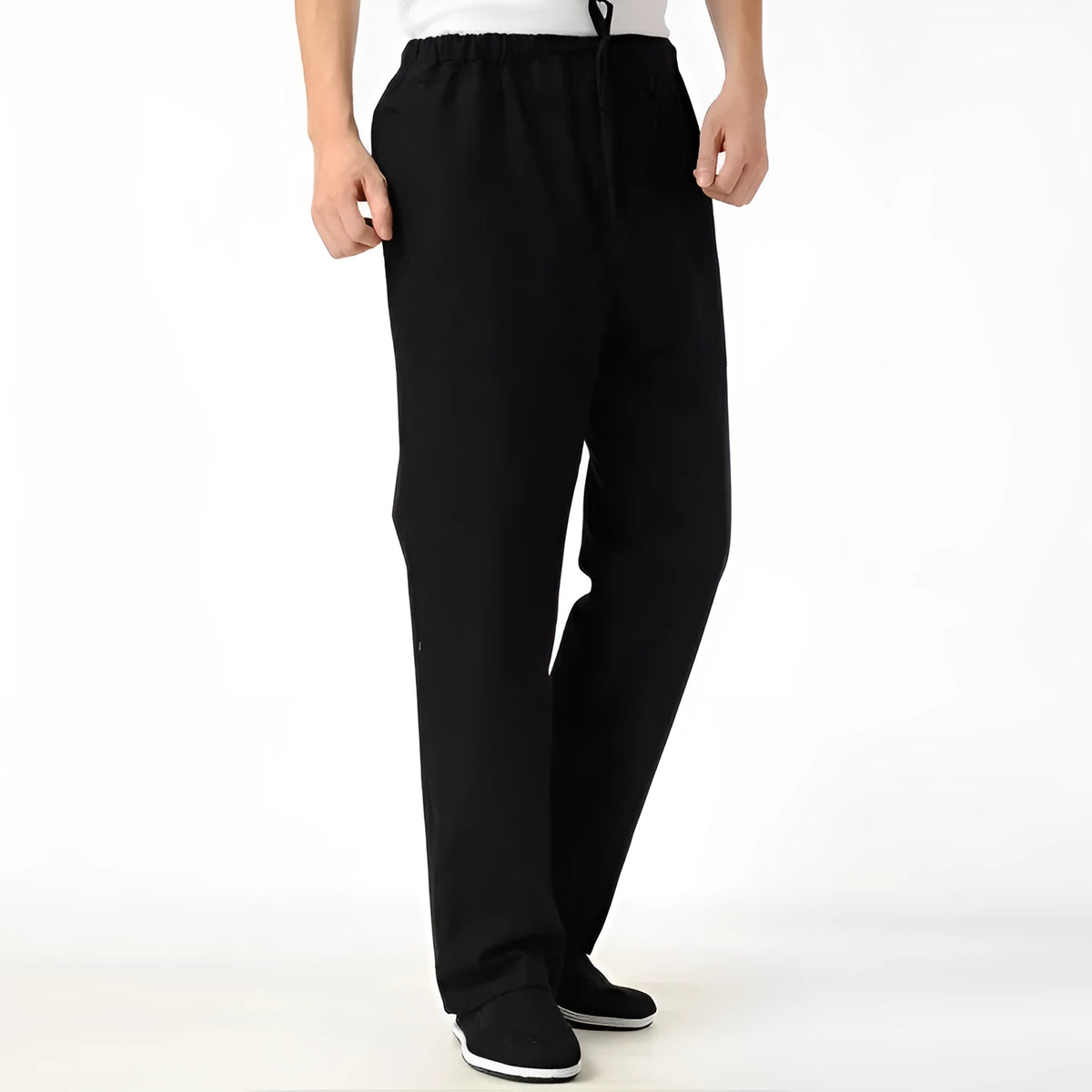 Men's beige pure cotton casual trousers with a drawstring waist on a mid-grey background.