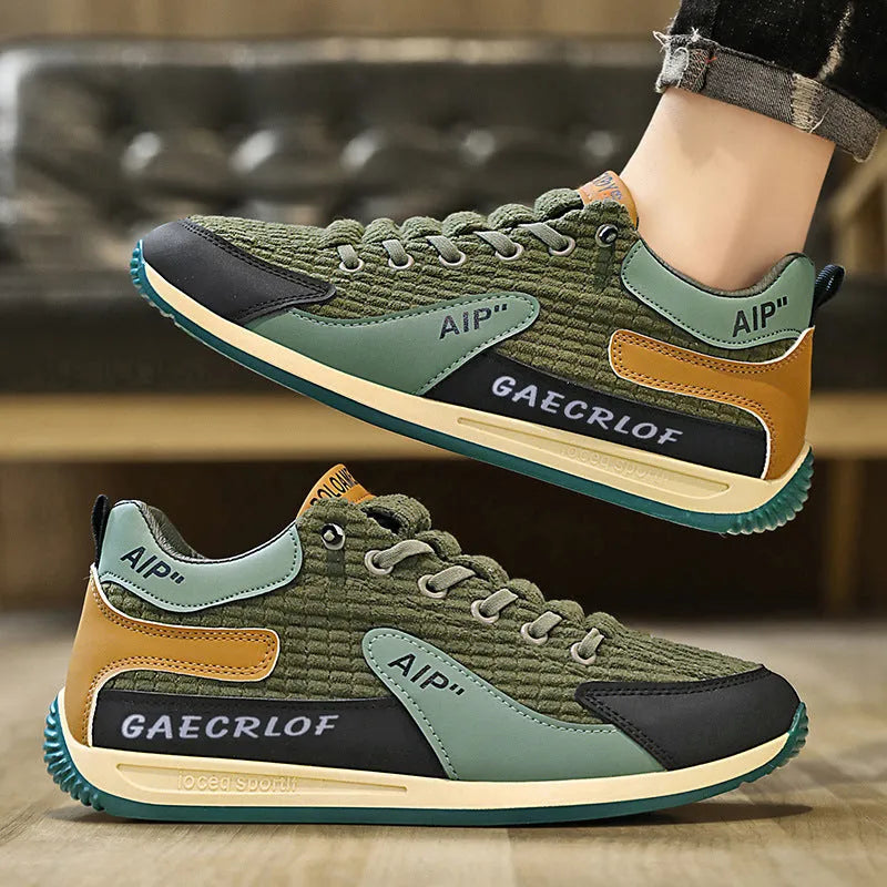 Men's grey and green mesh running shoes with lace-up front and low-top ankle design