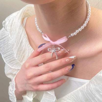 Love heart and bow tie clavicle chain necklace with pearl inlay, shown in White K Love 028 and White K Bow 026 options.