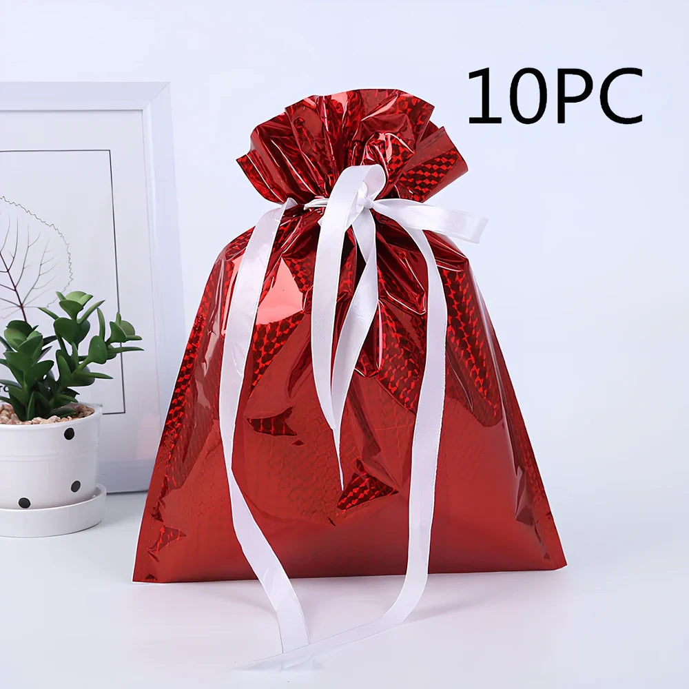 Christmas gift bag with drawstring closure in laser gold finish, 32x24cm dimensions