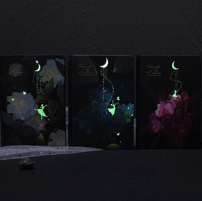 A5 notebook with luminous cover in Deep Blue, open to show 100 gsm paper and colour illustrations