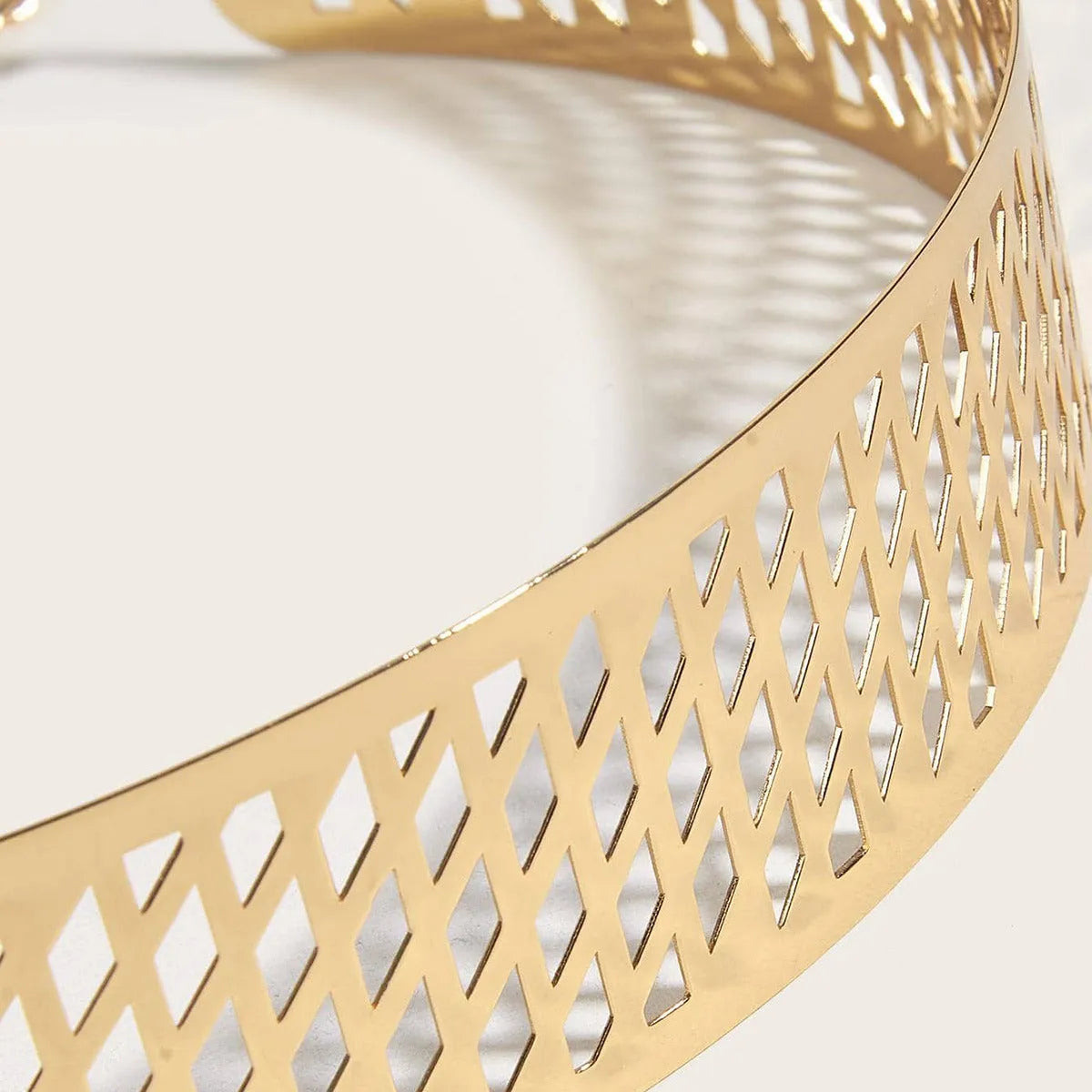 Golden waist belt with lantern floral punch design showing thick 4.5cm width and alloy buckle