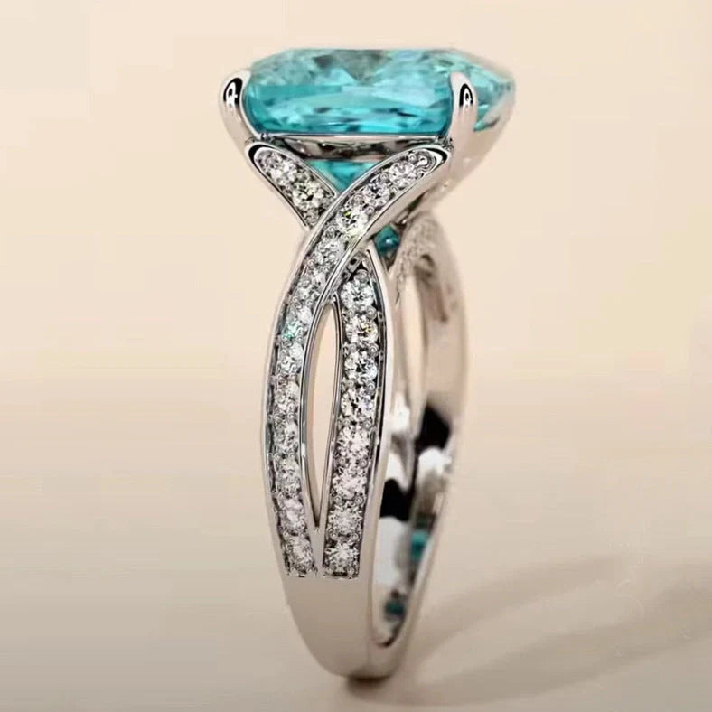 Adjustable women's ring with 4mm square blue zircon stone on silver-tone band