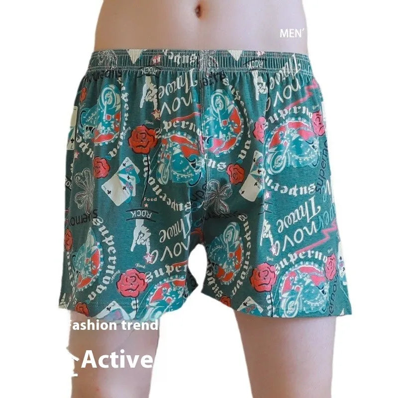 Men's grey printed cotton boxer shorts with mid waist and loose casual fit laid flat.