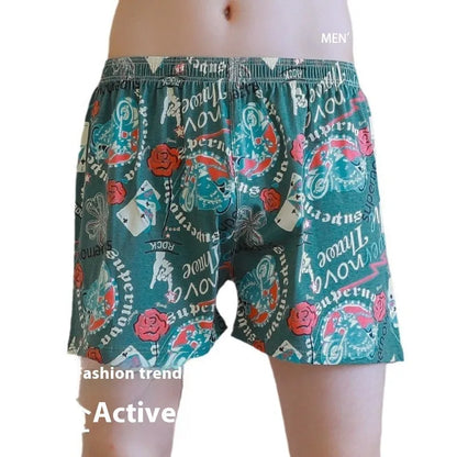 Men's grey printed cotton boxer shorts with mid waist and loose casual fit laid flat.