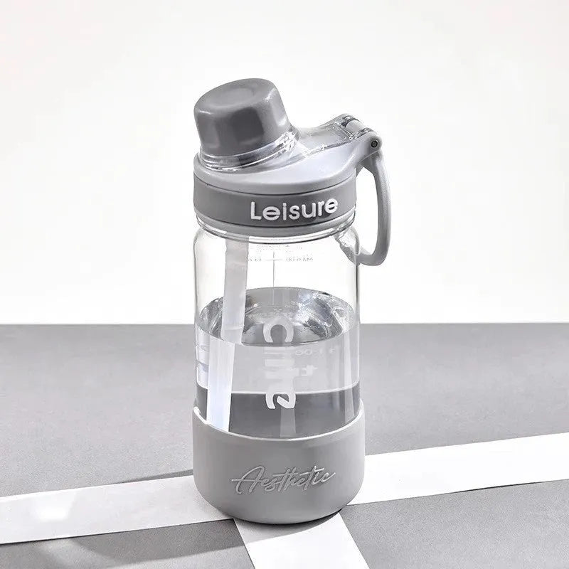 Grey portable plastic cup with built-in straw, shown in 1000ml size with modern cylindrical design.