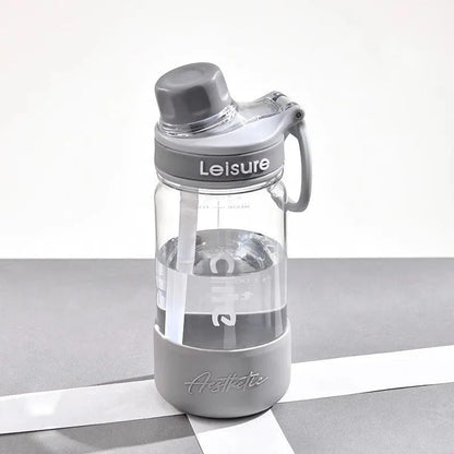 Grey portable plastic cup with built-in straw, shown in 1000ml size with modern cylindrical design.