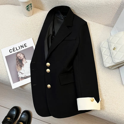 Milky white loose fit Korean-style women's coat with long sleeves and pockets.