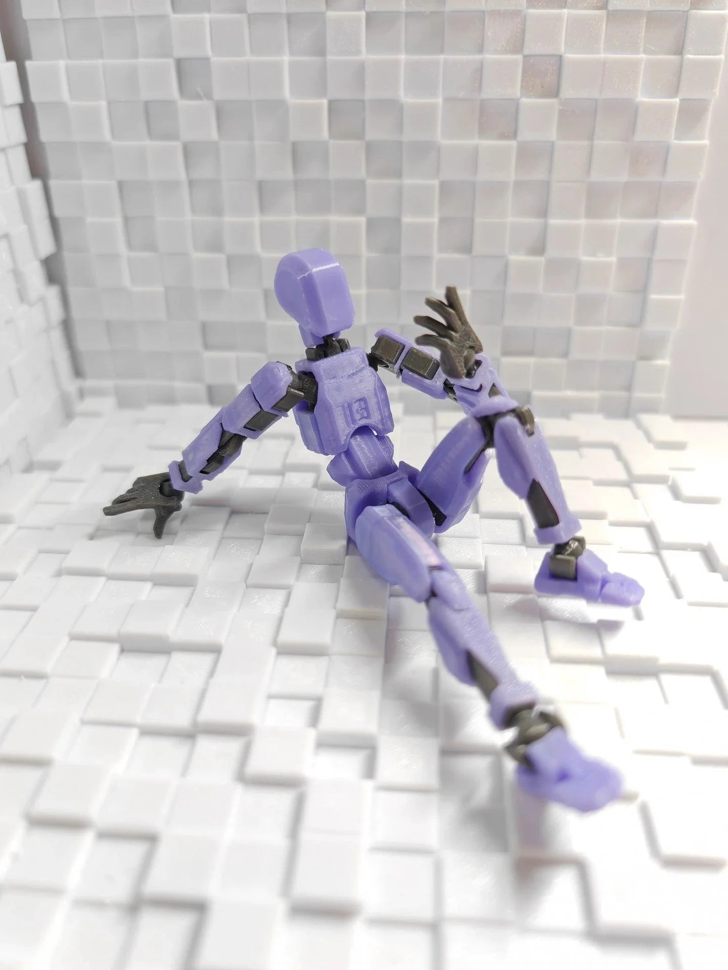 Versatile multi-jointed robotic action figure with customizable posing and design capabilities