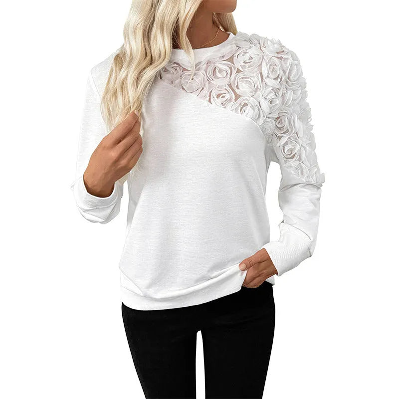 White long sleeve top with floral pattern, loose fit, regular sleeves, pullover style