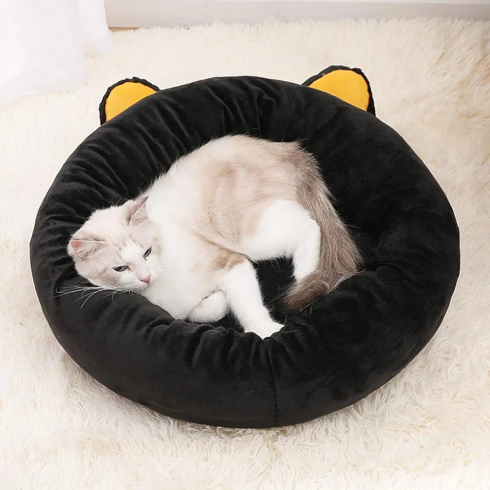 Black cat-shaped velvet pet nest bed with raised edges showing S and M size options