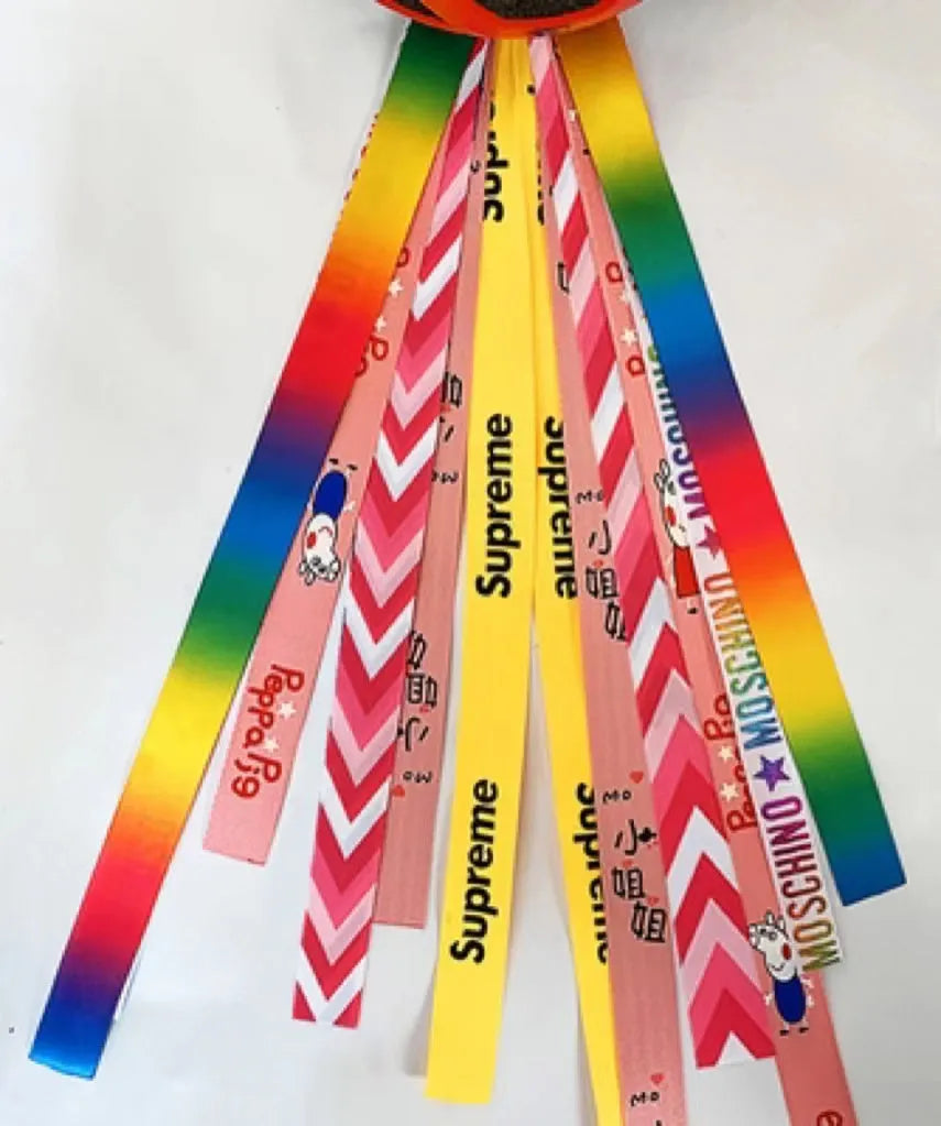 Children's helmet streamer with 60 cm polyester ribbon in colours like apricot and khaki for roller skating and skiing