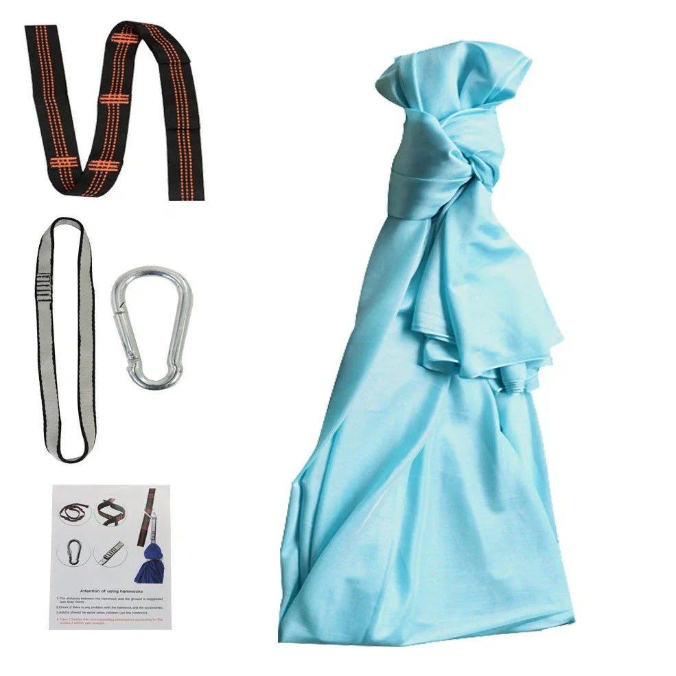 Child in black therapy swing cocoon with multi-loop daisy chain height adjustment system