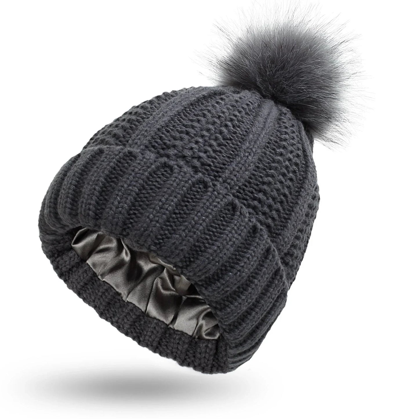 Cozy satin-lined knit beanie with plush faux fur pom-pom in various colors for women