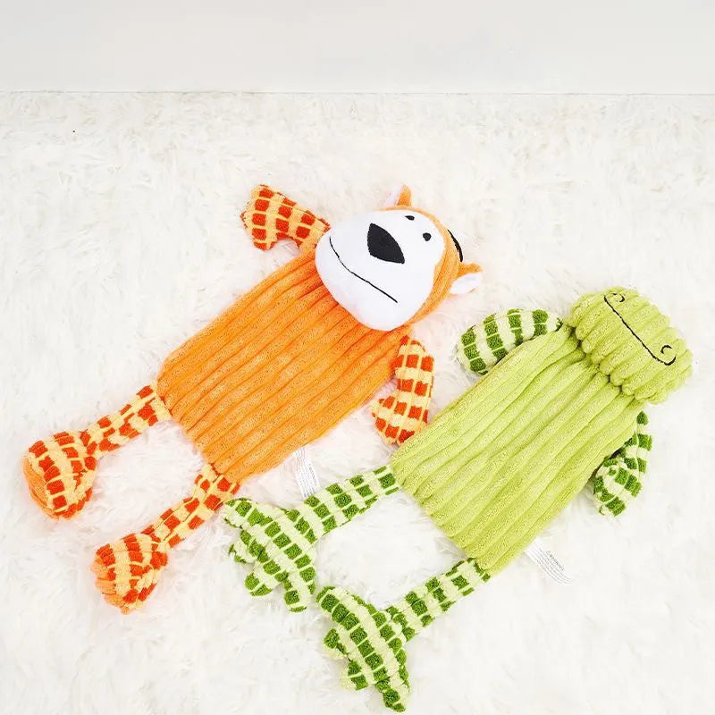Green and orange plush dog toy with a squeaker for aggressive chewers.