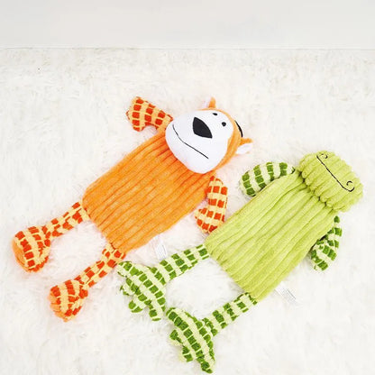 Green and orange plush dog toy with a squeaker for aggressive chewers.