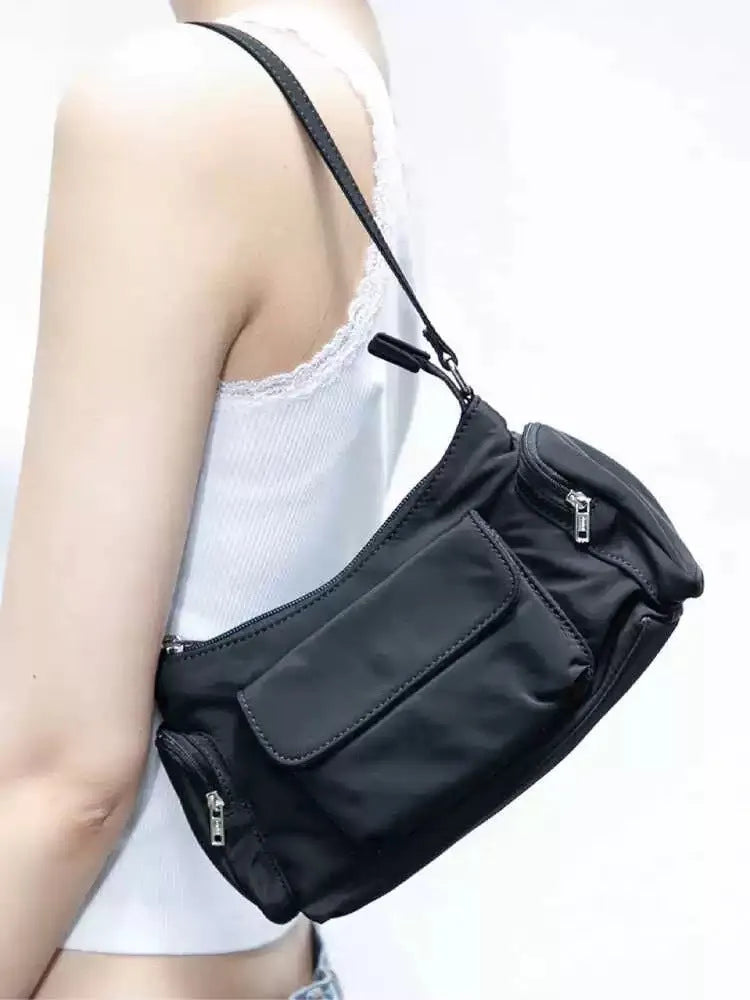 Black PU women's shoulder bag with two pockets and side line detailing, showing dimensions of 24cm length
