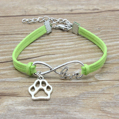 Hand-woven Infinite Love Pet Bracelet in various colors, showcasing the bow shape and alloy material.