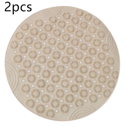 Textured round shower mat with anti-slip surface, massage nodules, and drainage holes for a comfortable and safe bathing experience