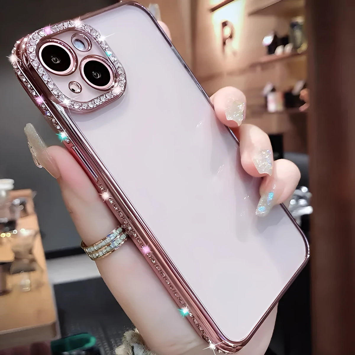 Rhinestone phone case with glass back and TPU silicone bumper for iPhone, in blue, purple, rose gold, or silver.