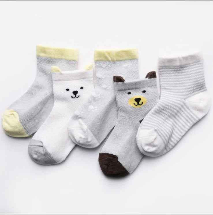 Vibrant 5-pack cotton kids' socks for boys and girls, perfect for summer comfort and style.