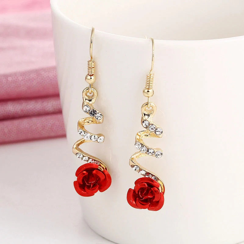 Ethnic red rose drop earrings with big rhinestones in rose gold spiral design