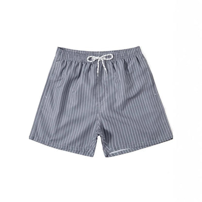 Pair of grey striped polyester shorts with a straight leg cut on a mannequin