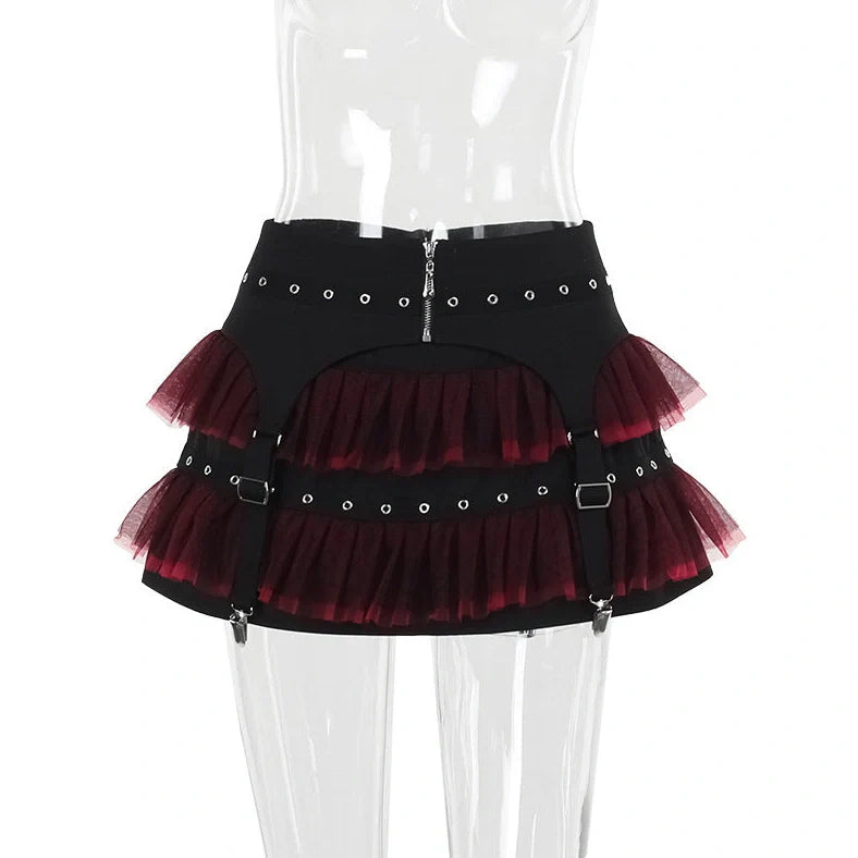 Dark coloured women's summer trousers with matching short skirt on hanger