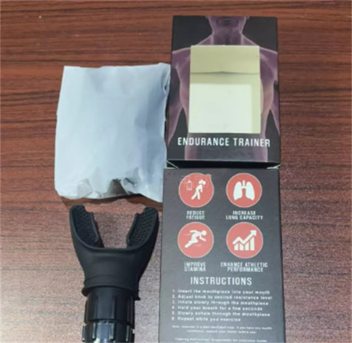 Portable breathing trainer in white and black with adjustable resistance for enhanced lung capacity