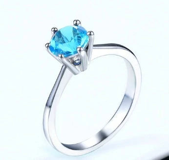 Exquisite rose gold and zircon cocktail ring with intricate geometric design and sparkling zircon gemstones