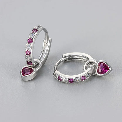 Fashion zircon earrings with 10mm heart-shaped drops in gold and white gold settings, showing diamond-treated stones