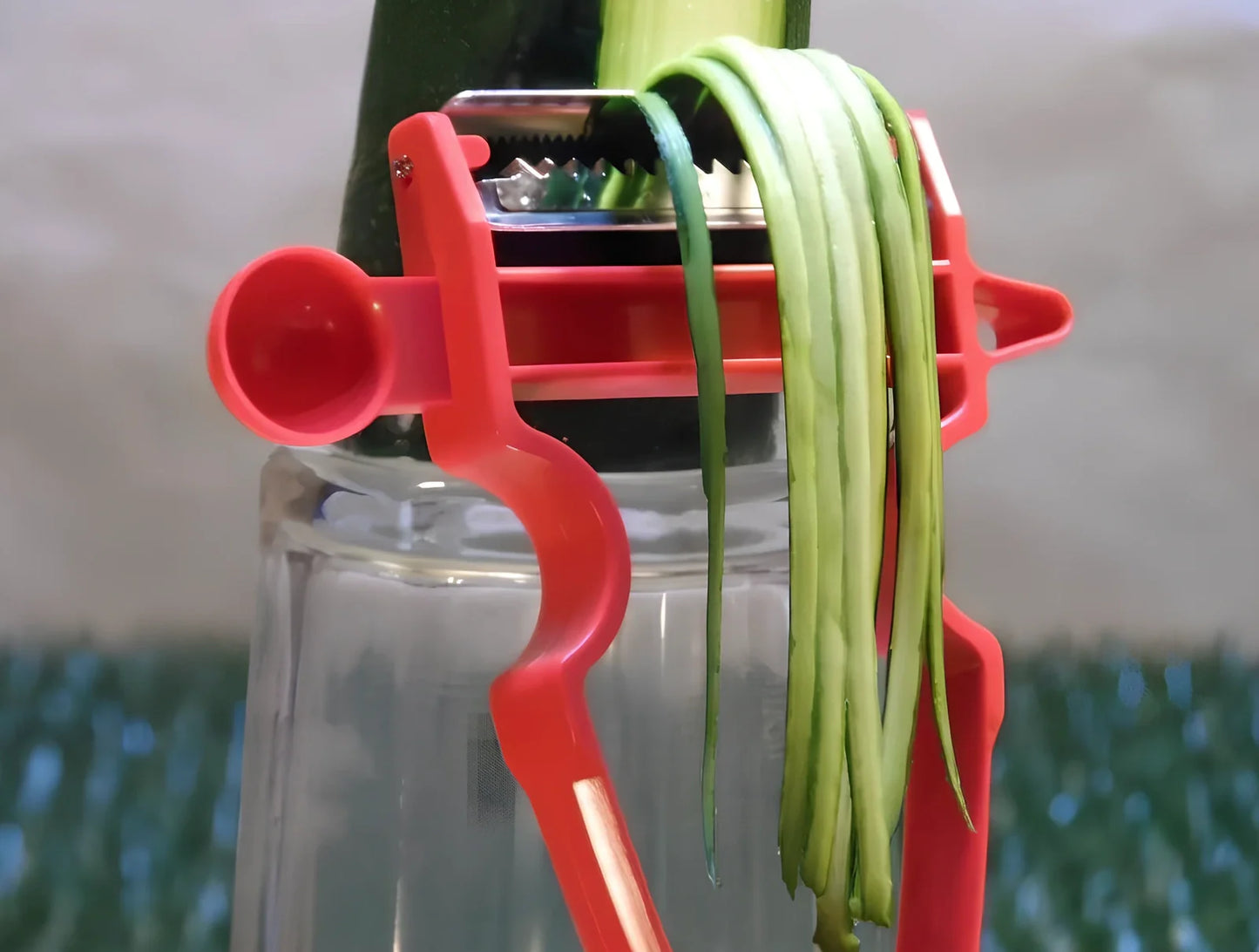 Stainless steel vegetable peeler set with black, blue, red handles and dual swivel blades