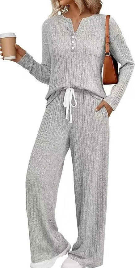 V-neck striped knit long coat with lace-up details and multiple pockets in light grey colour