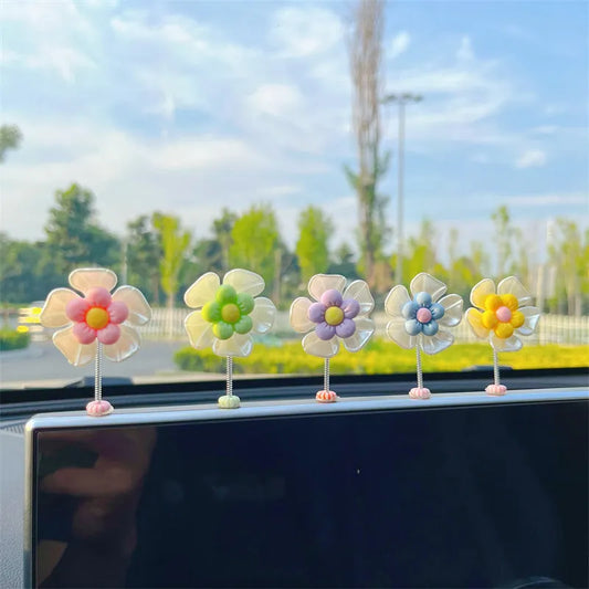 Small plastic car decoration swing in blue, green, pink, purple, or yellow colours, measuring 5cm tall