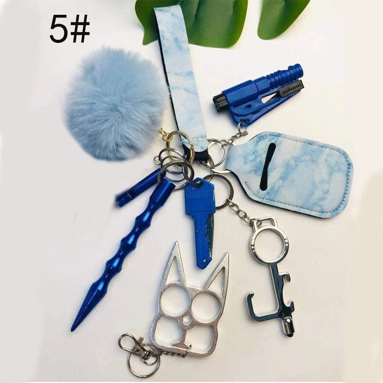 Self-defense keychain set for women with 11 safety tools including alarm and window breaker