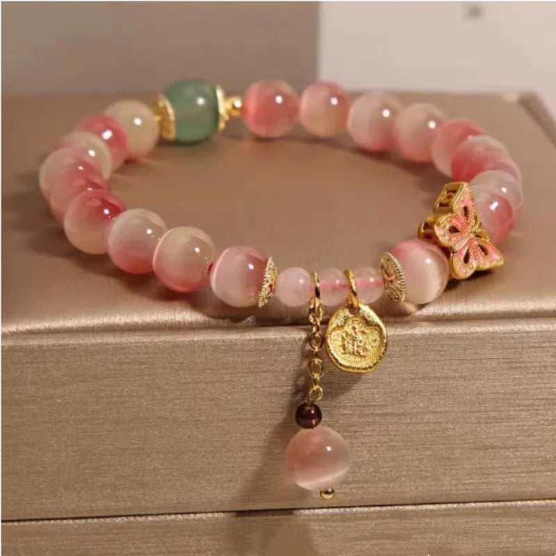 Pink opal butterfly women's bracelet with Chinese-style detailing and electroplated metal