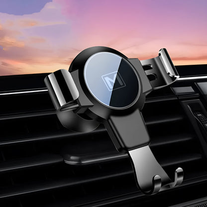 Black S4 ABS gravity mobile phone holder clipped onto a car air conditioning vent.