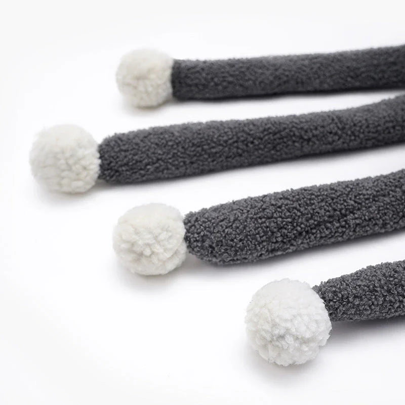 Cozy octopus-shaped pet bed with soft, plush fabric and raised 'eyes' for natural headrest