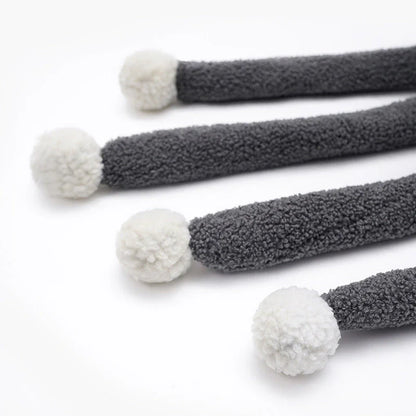 Cozy octopus-shaped pet bed with soft, plush fabric and raised 'eyes' for natural headrest