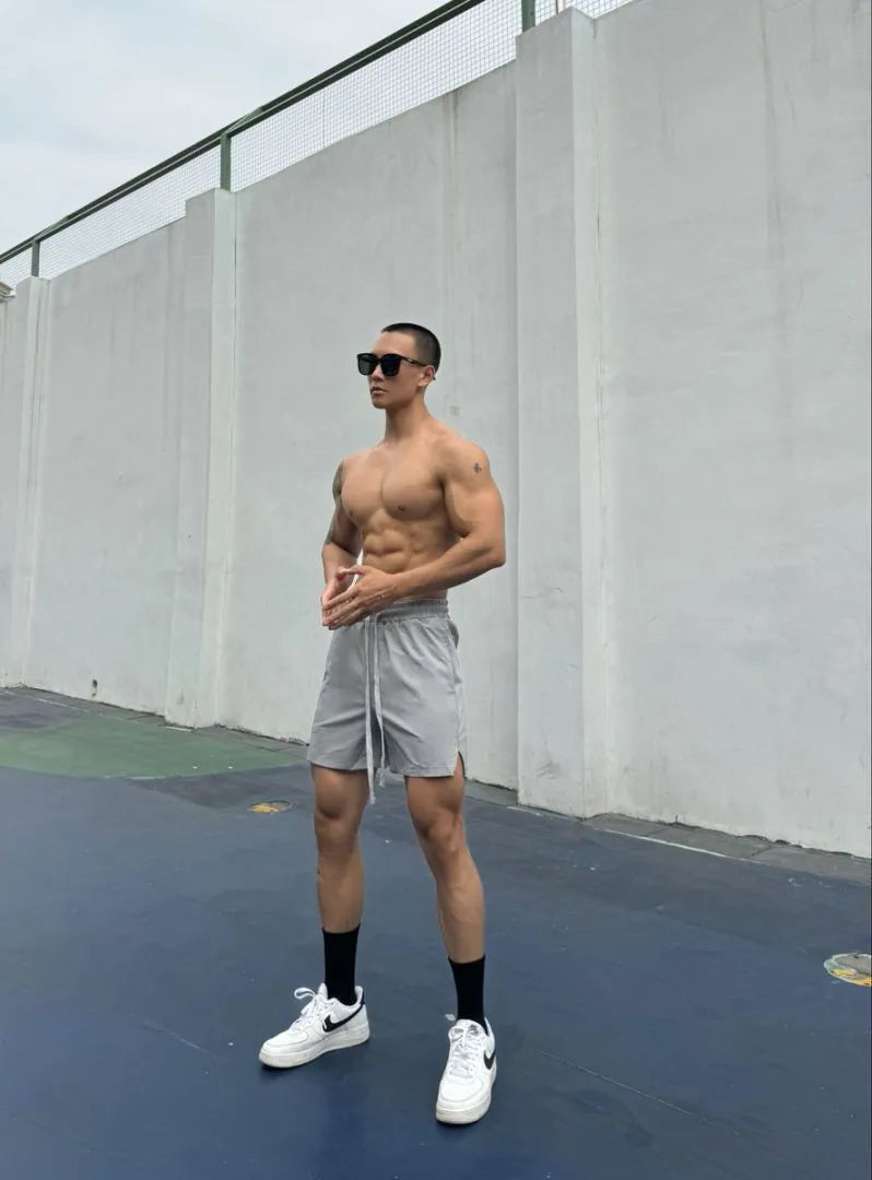 Men's ice silk quick-drying double-layer shorts in quarter-length design with nylon fabric