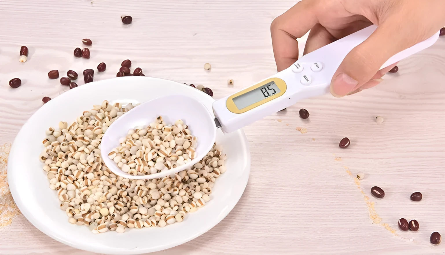 Black electronic measuring spoon scale showing digital display with spoon bowl for kitchen weighing